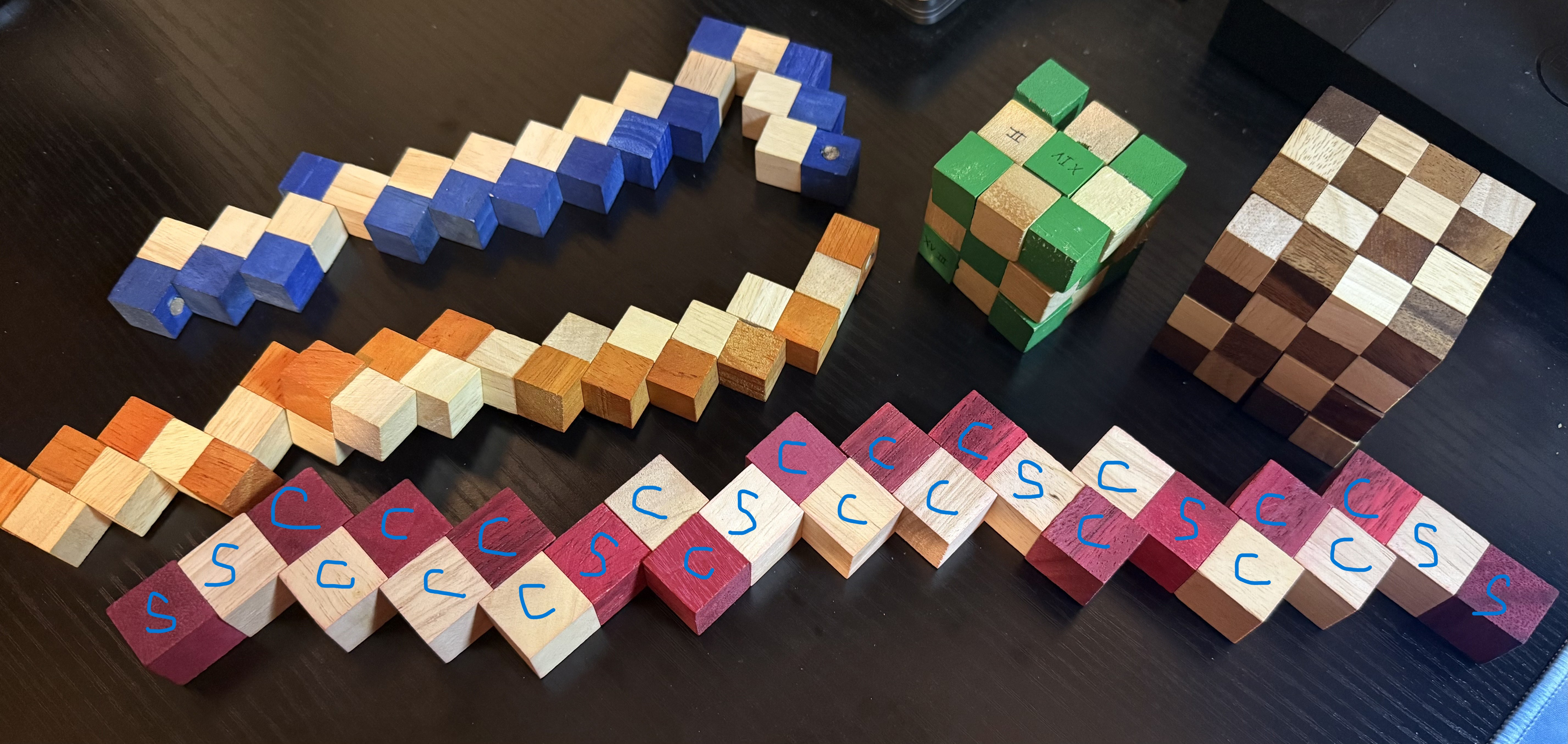 Solved snake cube with labeled blocks